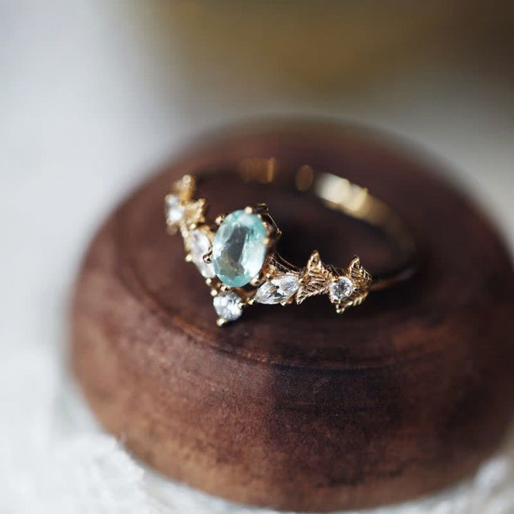 Anillo con forma de corona de circonita blanca y aguamarina de Olivenorma