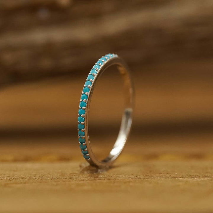 Anillo triple de circonitas blancas y turquesas bohemias de Olivenorma