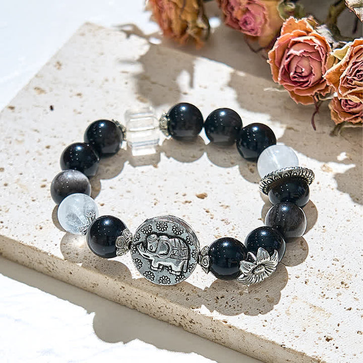 Pulsera con colgante de elefante de metal con cuentas de obsidiana plateada de Olivenorma