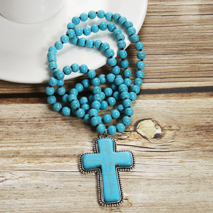 Collar con colgante en forma de cruz de turquesa azul y blanca de 8 mm de Olivenorma