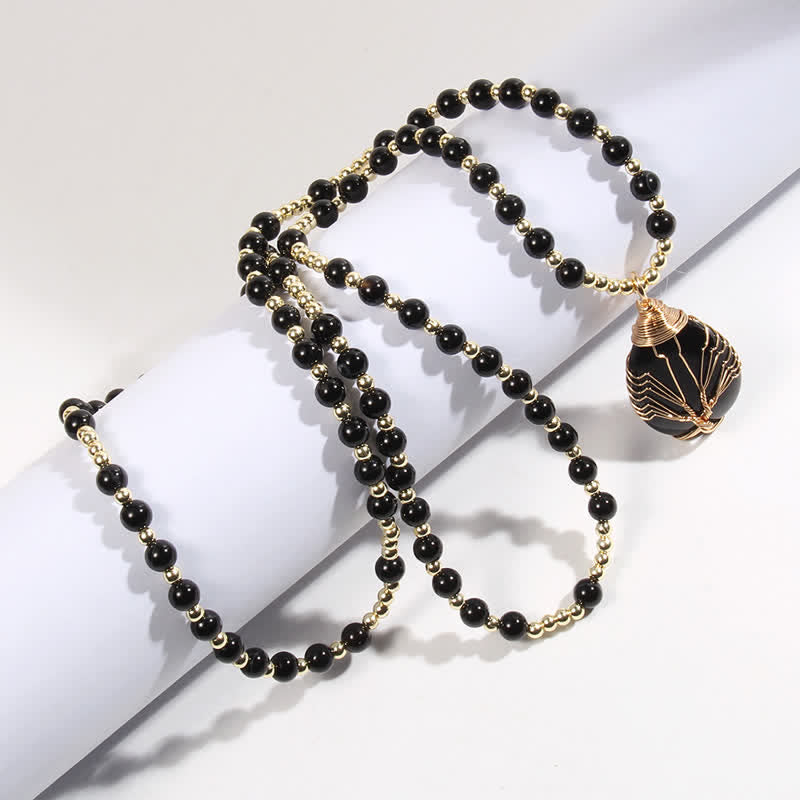Collar con colgante de árbol de la vida y cuentas de piedra de Olivenorma