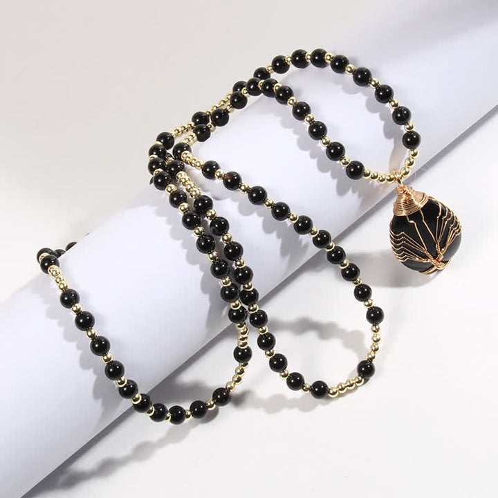 Collar con colgante de árbol de la vida y cuentas de piedra de Olivenorma