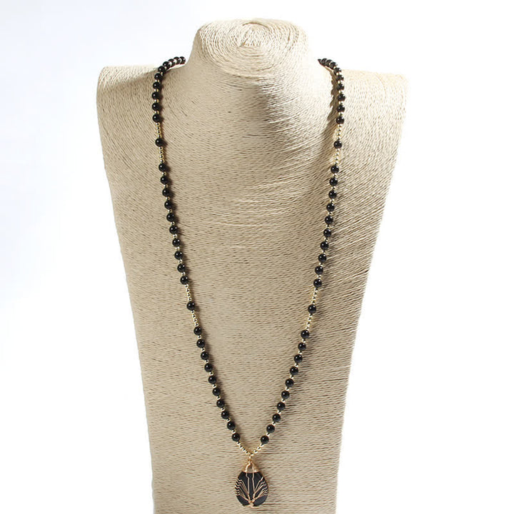Collar con colgante de árbol de la vida y cuentas de piedra de Olivenorma