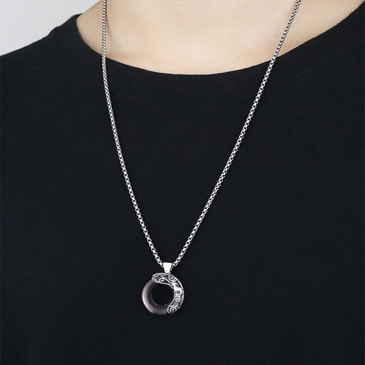 Colgante de obsidiana natural con el zodíaco de Olivenorma