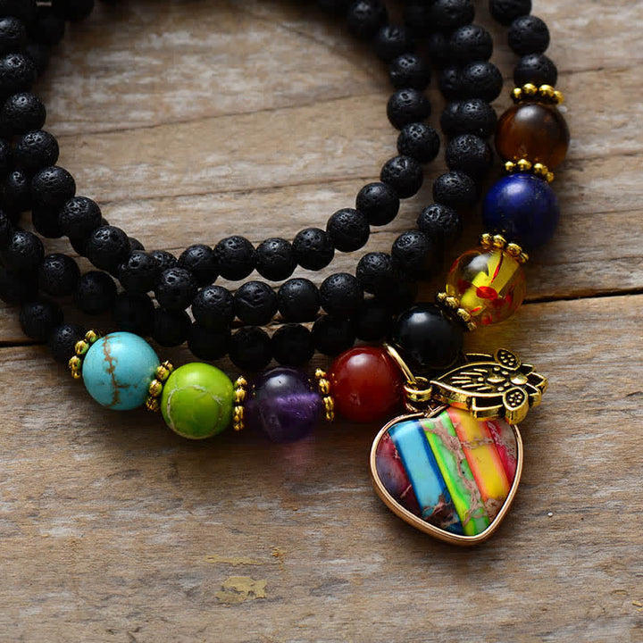Pulsera multicapa con cuentas de piedra de lava y colgante de chakra Olivenorma 