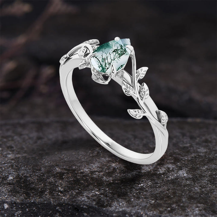 Anillo de compromiso con hojas retorcidas de ágata musgosa tallada en forma de pera de Olivenorma