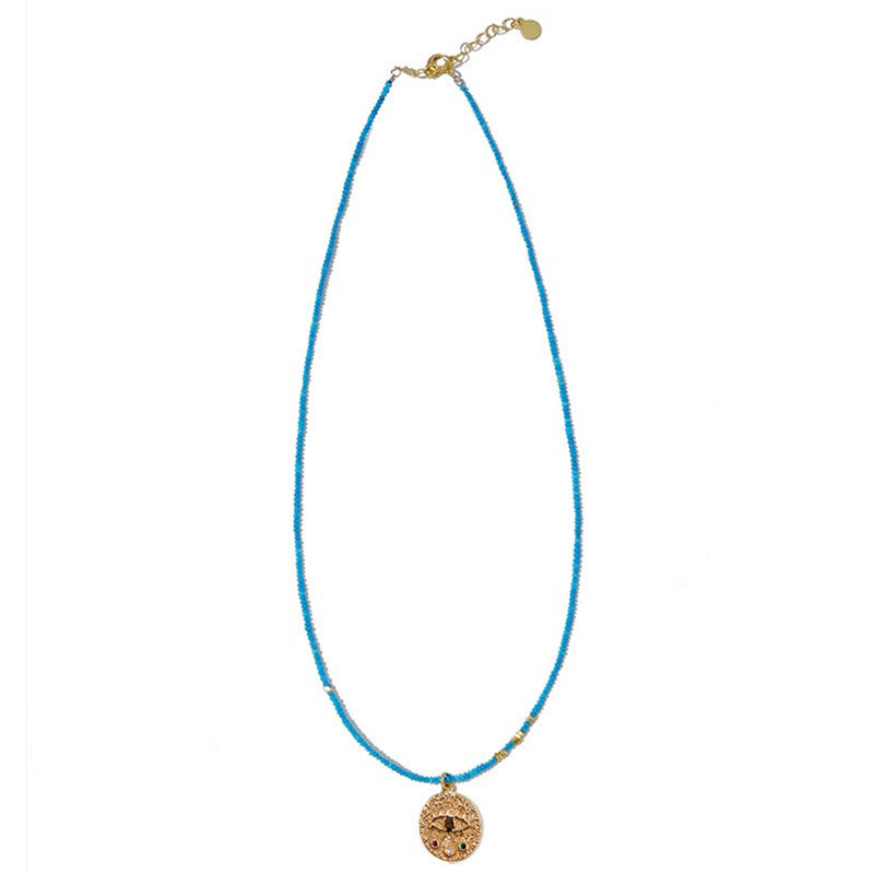 Collar de cuentas turquesas con dije de mal de ojo de Olivenorma