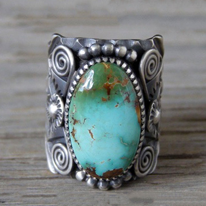 Anillo llamativo tallado en turquesa ovalada genuina de Olivenorma