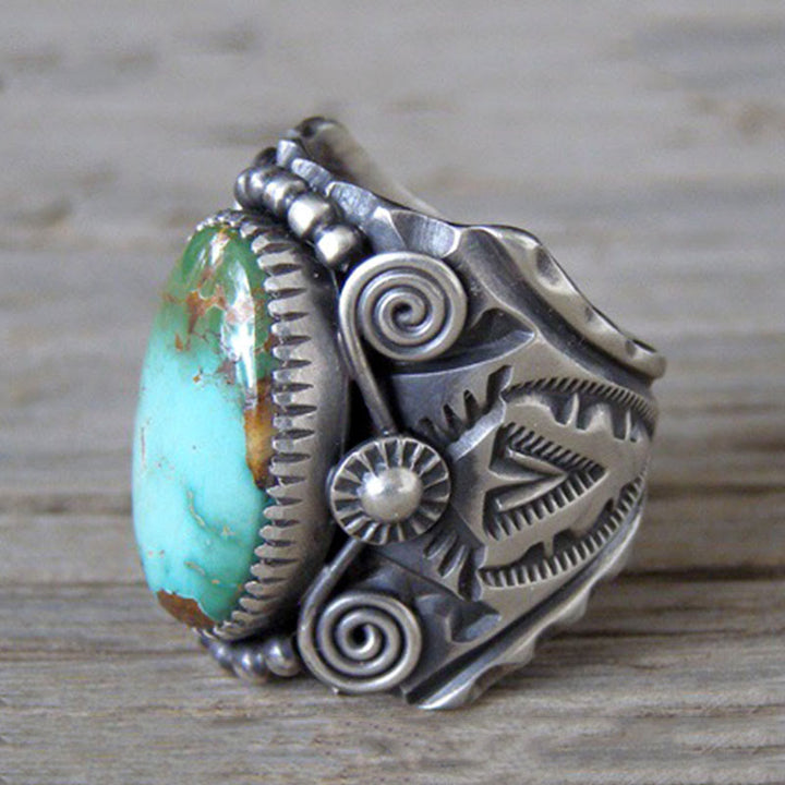 Anillo llamativo tallado en turquesa ovalada genuina de Olivenorma