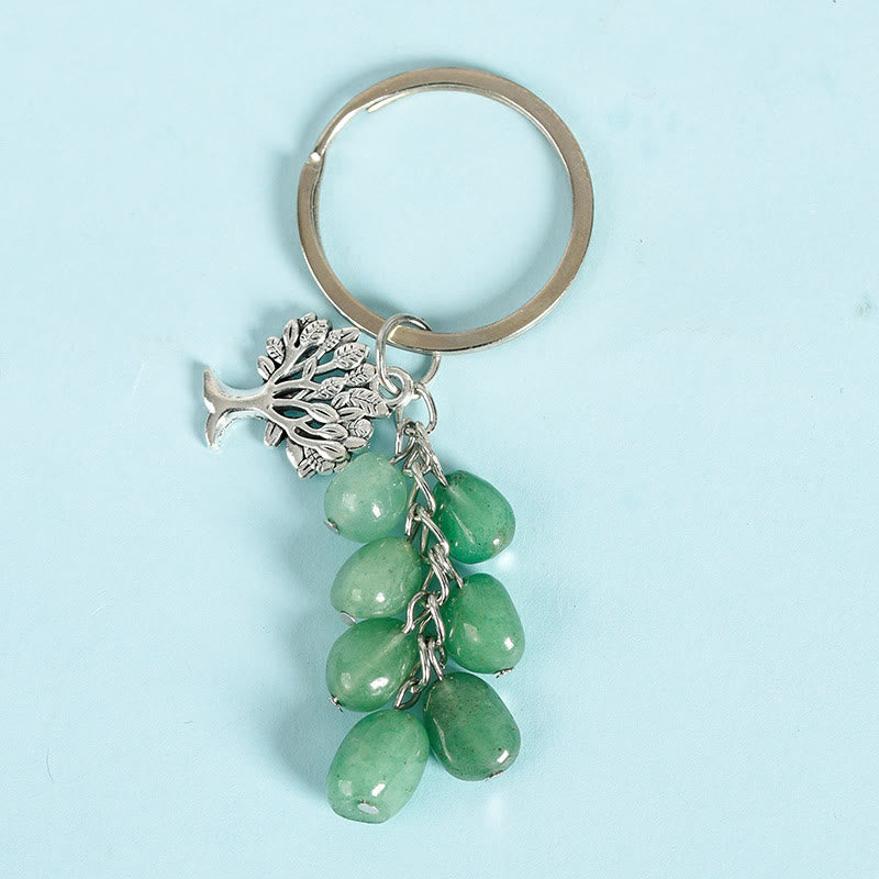 Llavero con piedra cruda natural de Olivenorma y árbol de la vida