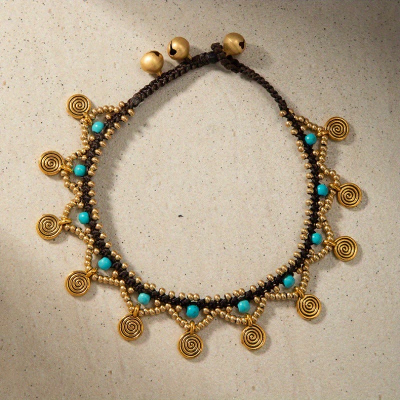 Tobillera tejida con borlas turquesas estilo boho de Olivenorma