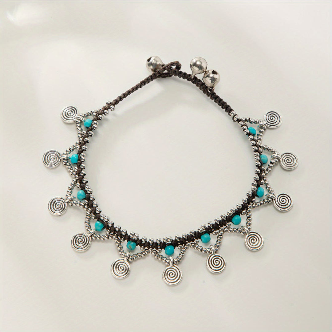 Tobillera tejida con borlas turquesas estilo boho de Olivenorma