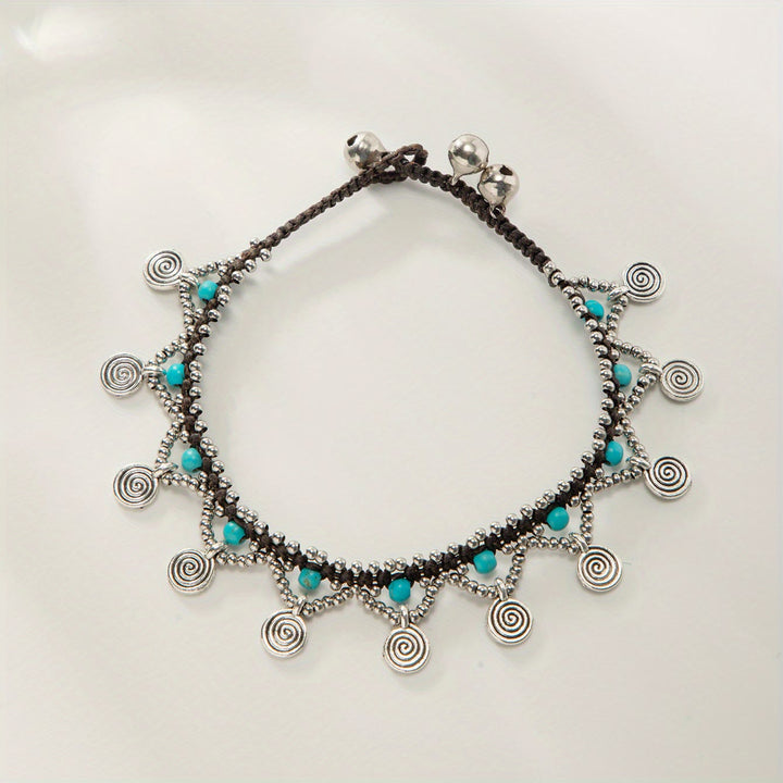 Tobillera tejida con borlas turquesas estilo boho de Olivenorma