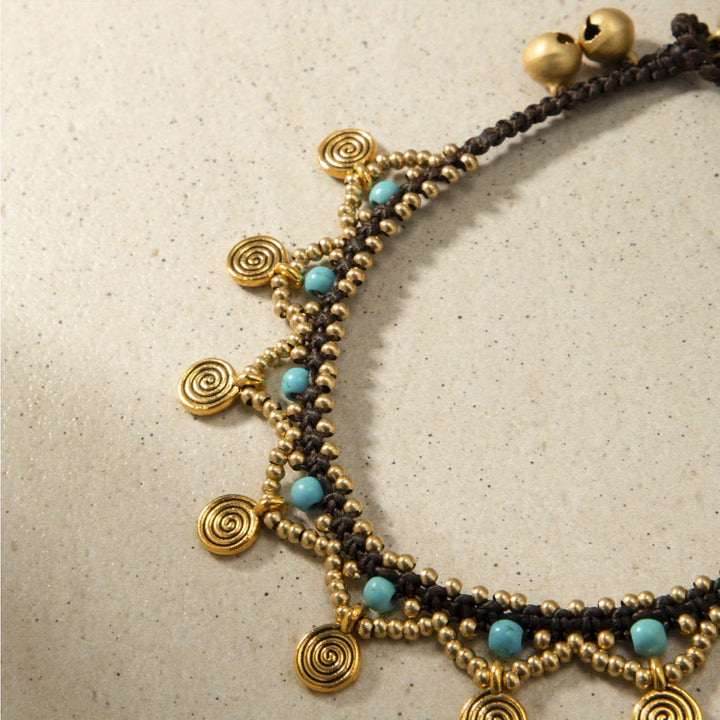 Tobillera tejida con borlas turquesas estilo boho de Olivenorma