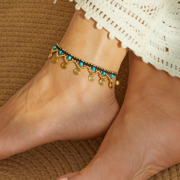 Tobillera tejida con borlas turquesas estilo boho de Olivenorma