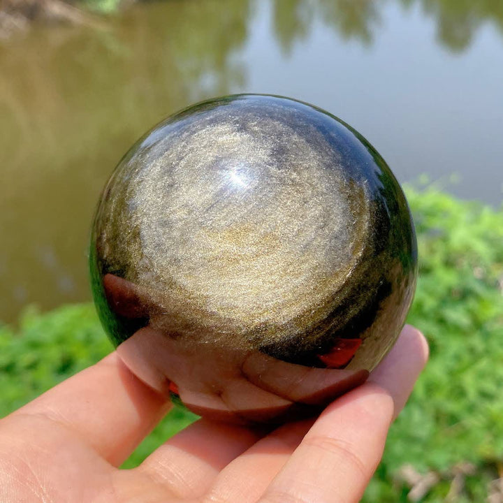 Esfera de cristal de obsidiana dorada natural de Olivenorma