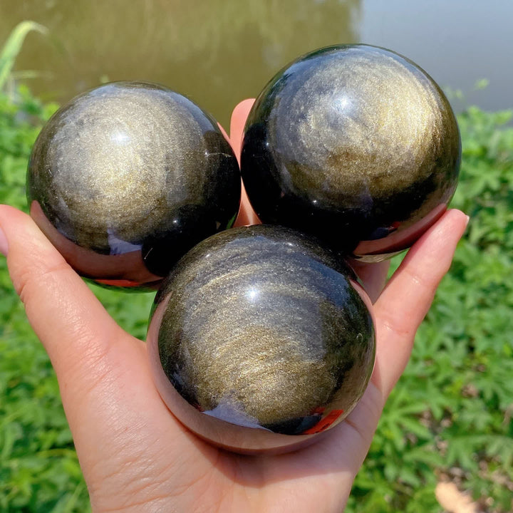 Esfera de cristal de obsidiana dorada natural de Olivenorma