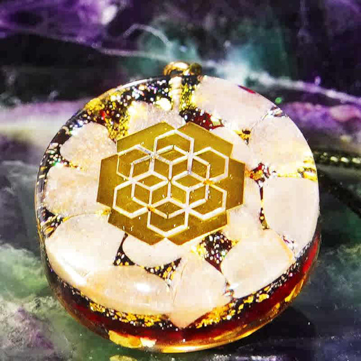 Collar de orgón con piedra solar y granate natural de Olivenorma