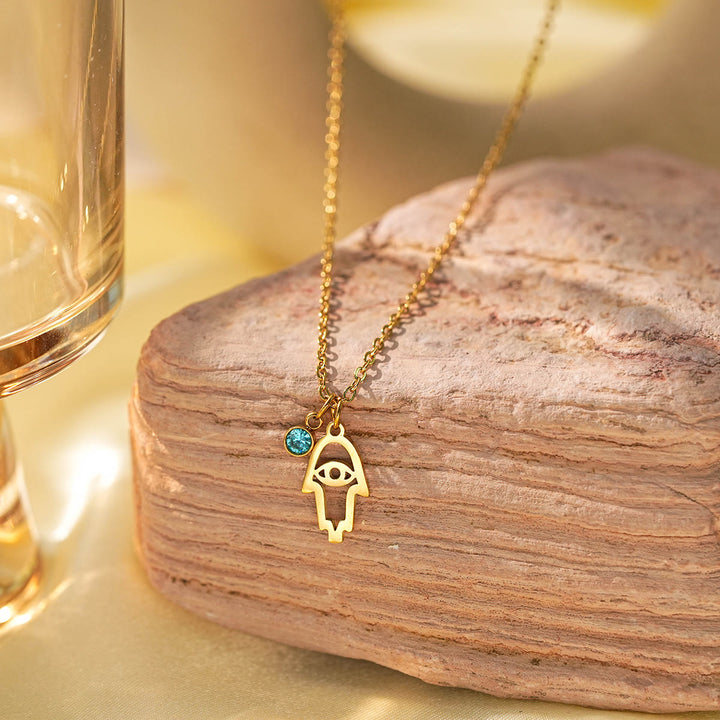 Collar con dije de cruz de aguamarina y símbolo de Hamsa con mal de ojo de Olivenorma