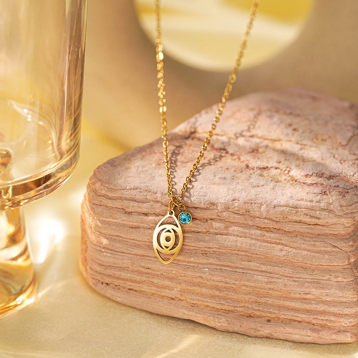 Collar con dije de cruz de aguamarina y símbolo de Hamsa con mal de ojo de Olivenorma