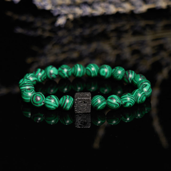 Pulsera de cuentas de malaquita y piedra de lava de Olivenorma