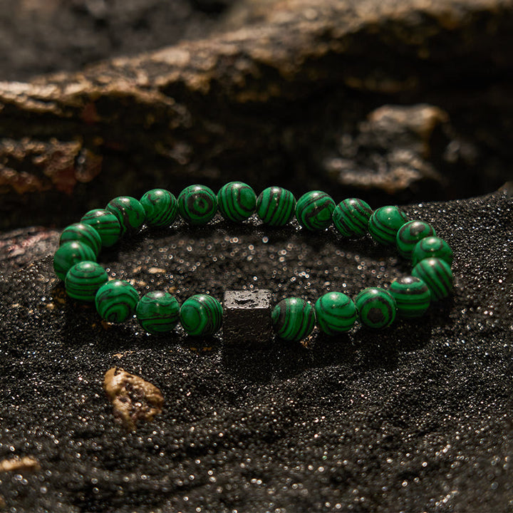 Pulsera de cuentas de malaquita y piedra de lava de Olivenorma