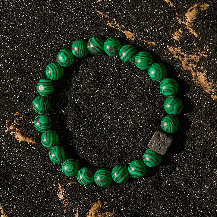 Pulsera de cuentas de malaquita y piedra de lava de Olivenorma