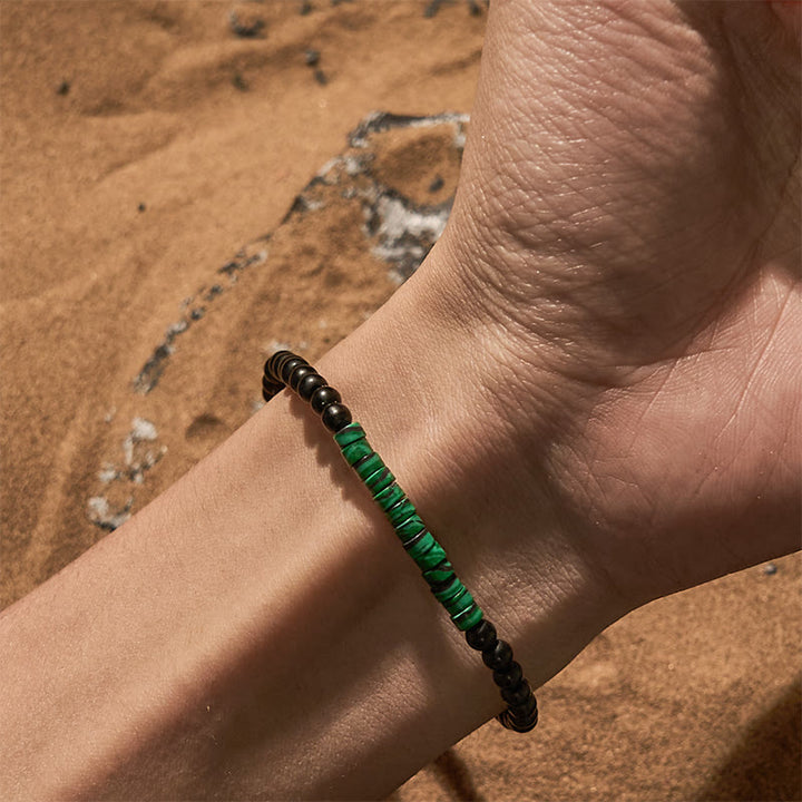 Pulsera de cuentas de malaquita y obsidiana con cuentas rodantes de Olivenorma