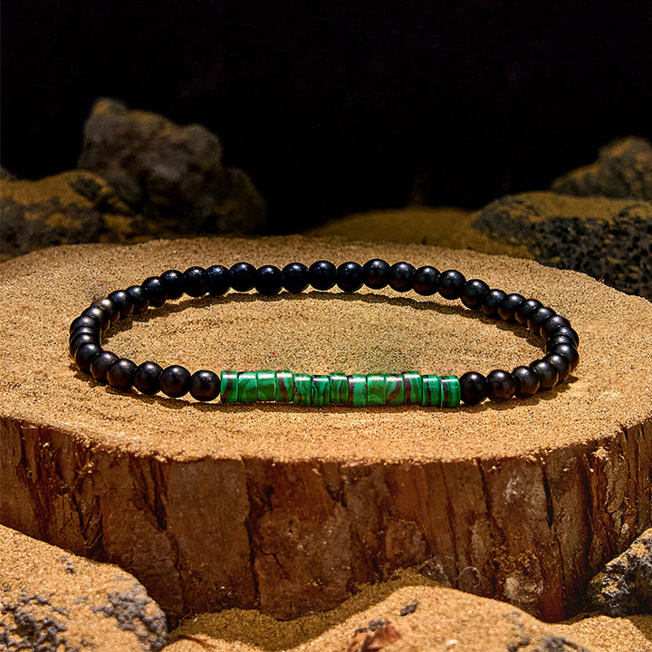 Pulsera de cuentas de malaquita y obsidiana con cuentas rodantes de Olivenorma