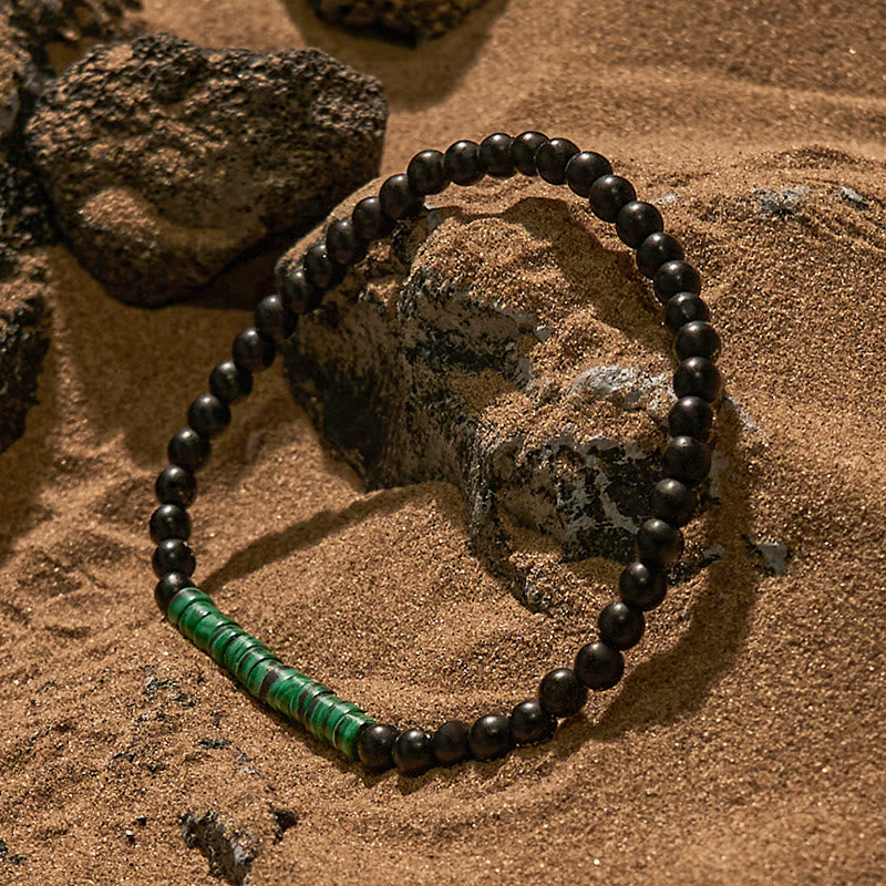 Pulsera de cuentas de malaquita y obsidiana con cuentas rodantes de Olivenorma