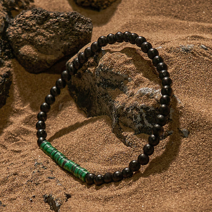 Pulsera de cuentas de malaquita y obsidiana con cuentas rodantes de Olivenorma