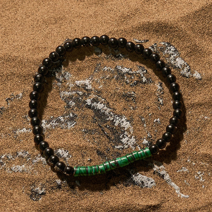 Pulsera de cuentas de malaquita y obsidiana con cuentas rodantes de Olivenorma