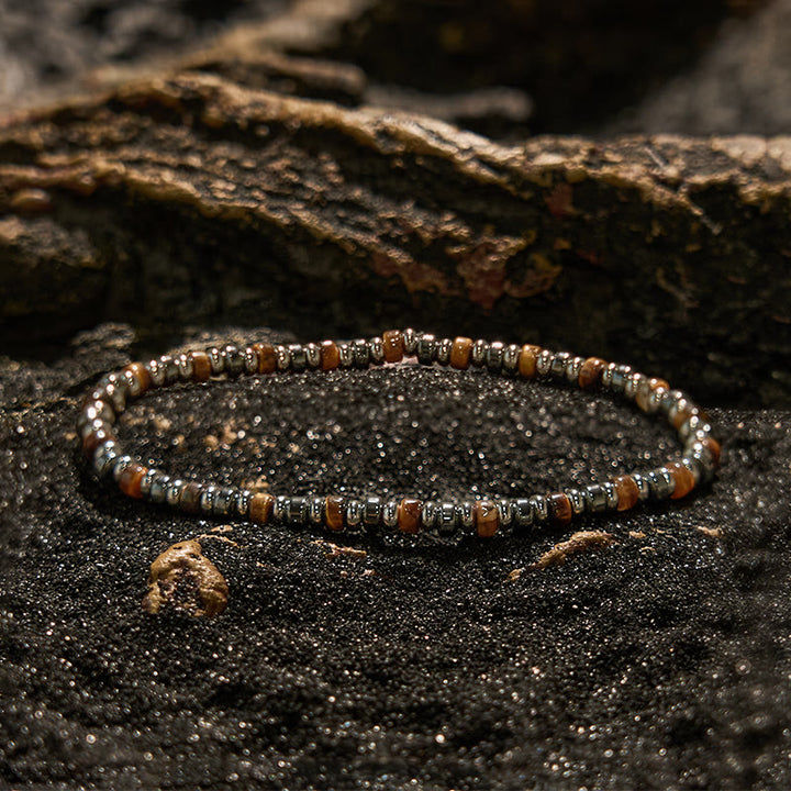 Pulsera de cuentas de hematita y ojo de tigre con cuentas rodantes de Olivenorma