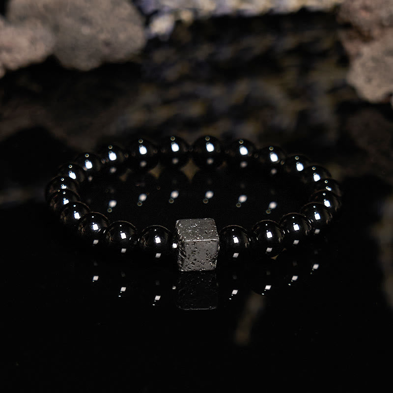 Pulsera de cuentas de obsidiana y piedra de lava tallada en cubos de Olivenorma