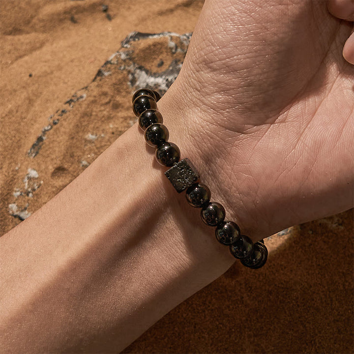 Pulsera de cuentas de obsidiana y piedra de lava tallada en cubos de Olivenorma