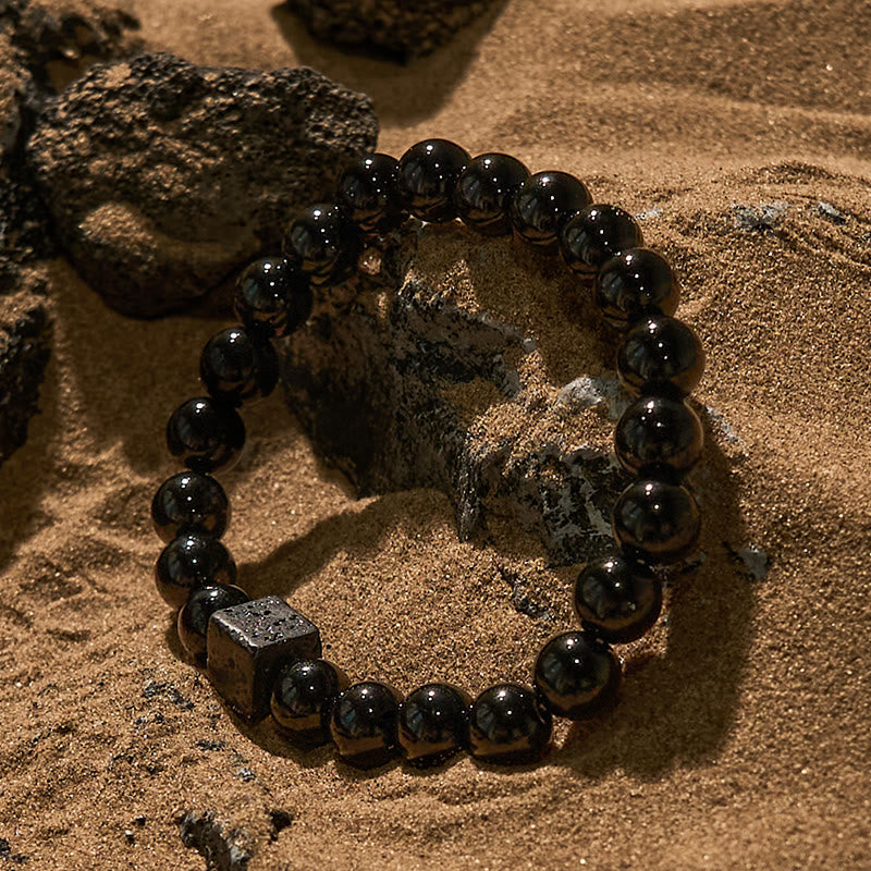 Pulsera de cuentas de obsidiana y piedra de lava tallada en cubos de Olivenorma