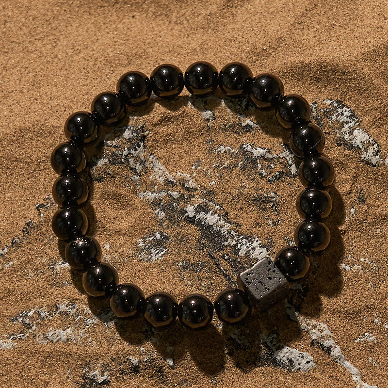 Pulsera de cuentas de obsidiana y piedra de lava tallada en cubos de Olivenorma