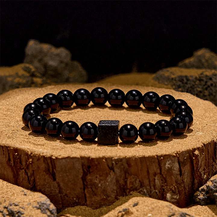 Pulsera de cuentas de obsidiana y piedra de lava tallada en cubos de Olivenorma