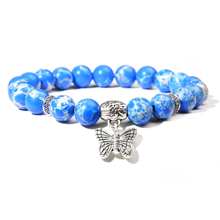 Pulsera con dije de mariposa de turquesa natural de Olivenorma