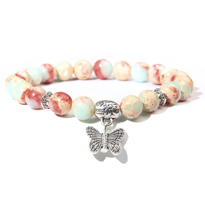 Pulsera con dije de mariposa de turquesa natural de Olivenorma