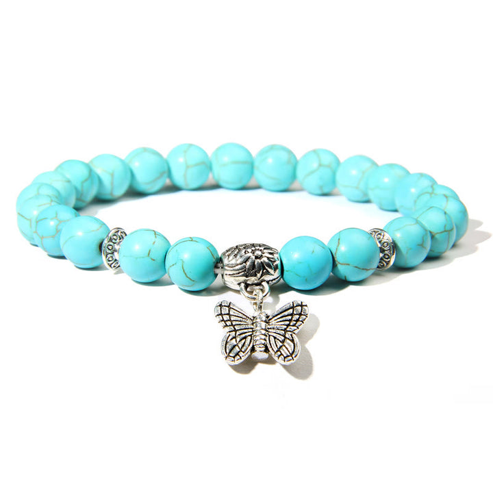 Pulsera con dije de mariposa de turquesa natural de Olivenorma