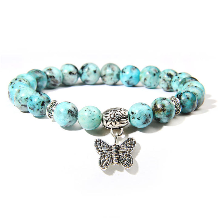 Pulsera con dije de mariposa de turquesa natural de Olivenorma