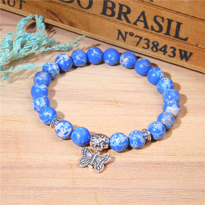 Pulsera con dije de mariposa de turquesa natural de Olivenorma
