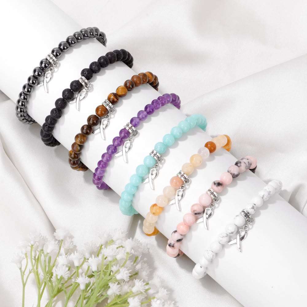 Pulsera de la suerte con cuentas de piedras preciosas naturales y dijes de cinta de Olivenorma