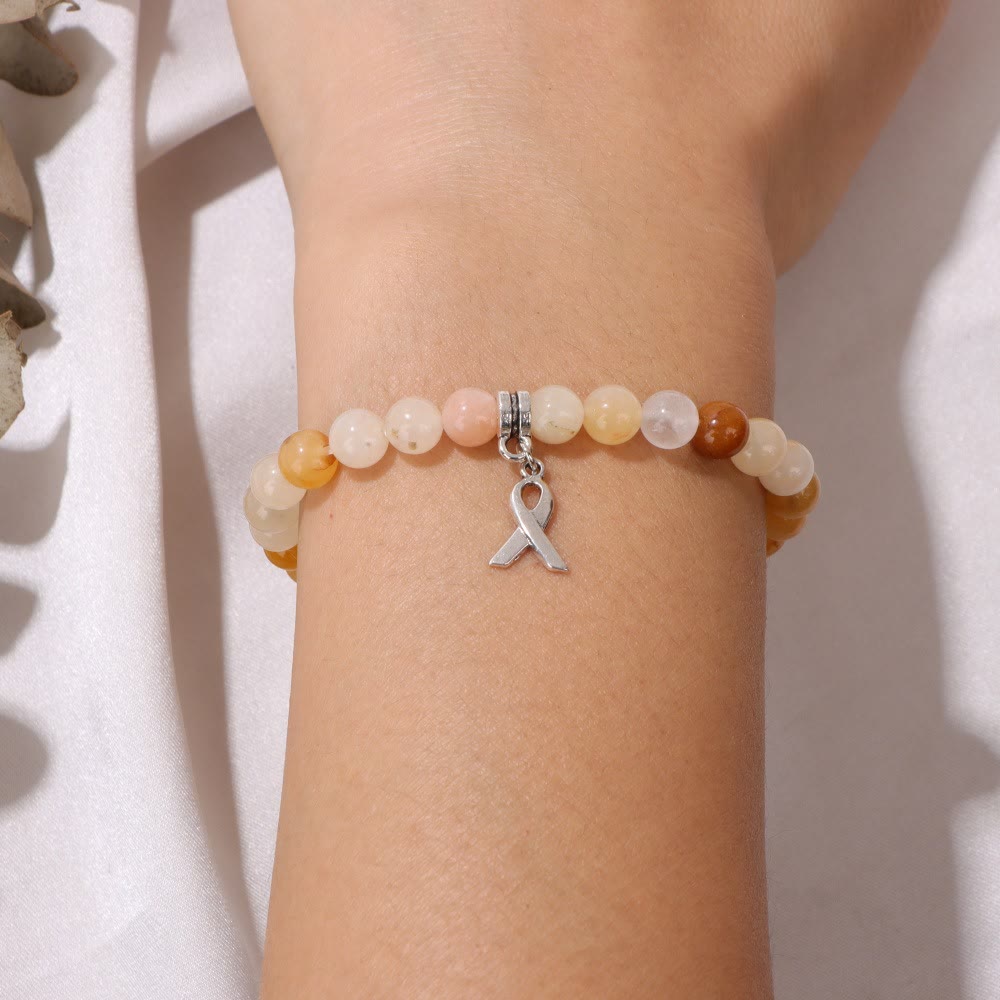 Pulsera de la suerte con cuentas de piedras preciosas naturales y dijes de cinta de Olivenorma