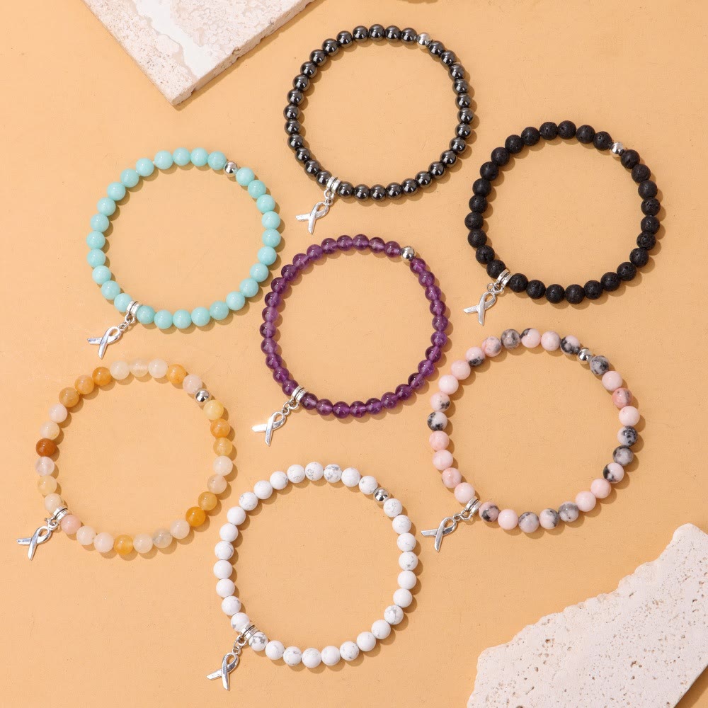 Pulsera de la suerte con cuentas de piedras preciosas naturales y dijes de cinta de Olivenorma