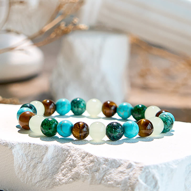 Pulsera de cuentas de peridoto y turquesa africana con ojo de tigre de Olivenorma