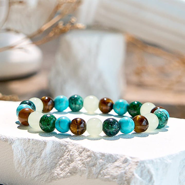 Pulsera de cuentas de peridoto y turquesa africana con ojo de tigre de Olivenorma