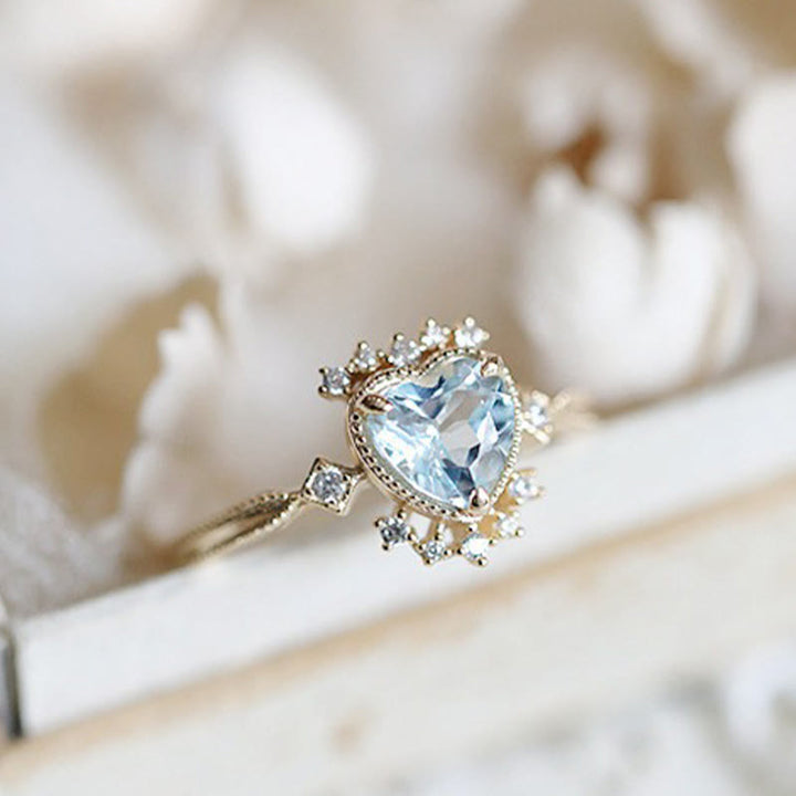 Anillo de topacio azul natural con circonita blanca de Olivenorma