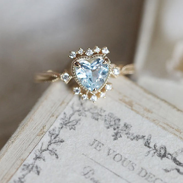 Anillo de topacio azul natural con circonita blanca de Olivenorma